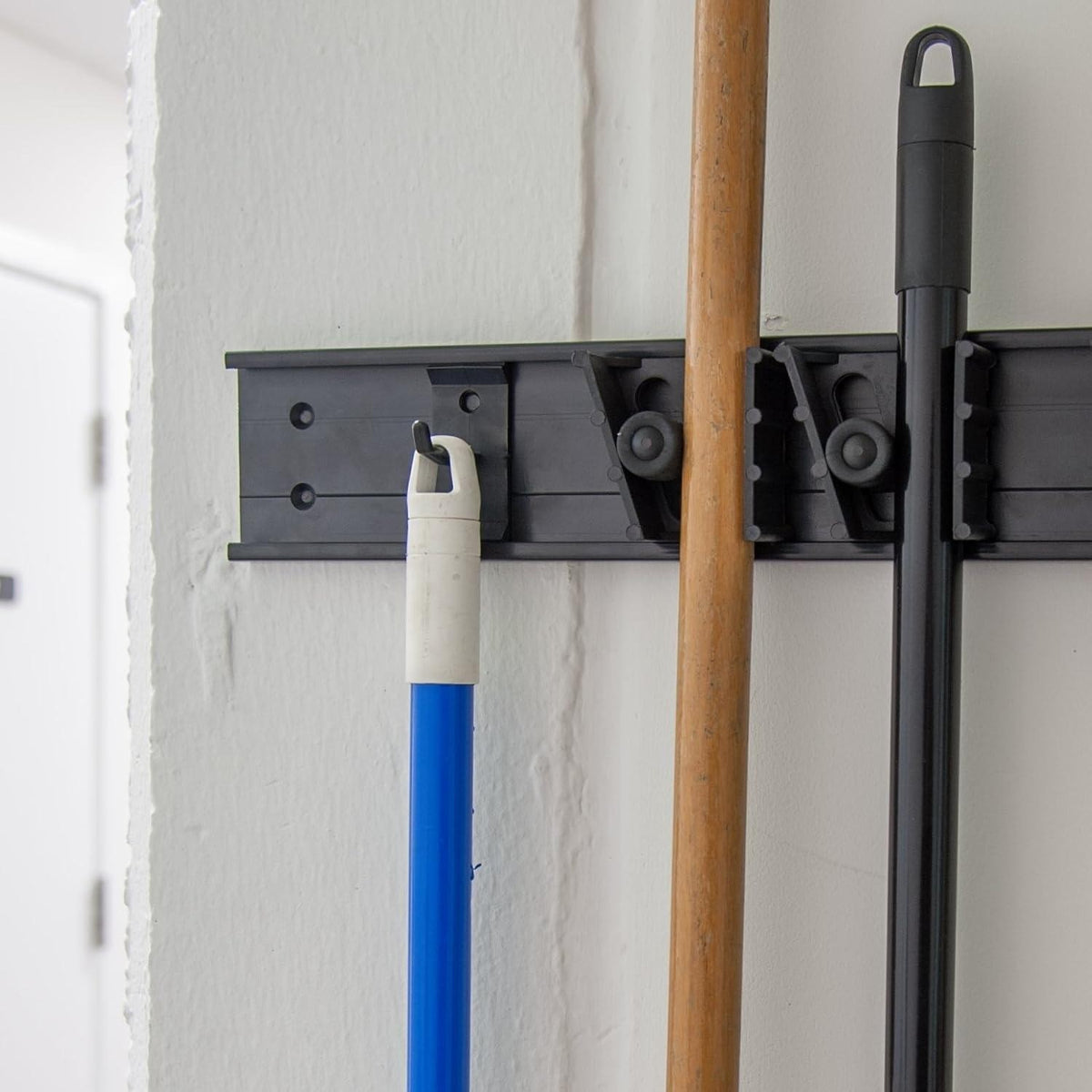 Set of 12 Carlisle 4073300 Roll 'N Grip Plastic Broom Holder Wall Mount, 1.75"